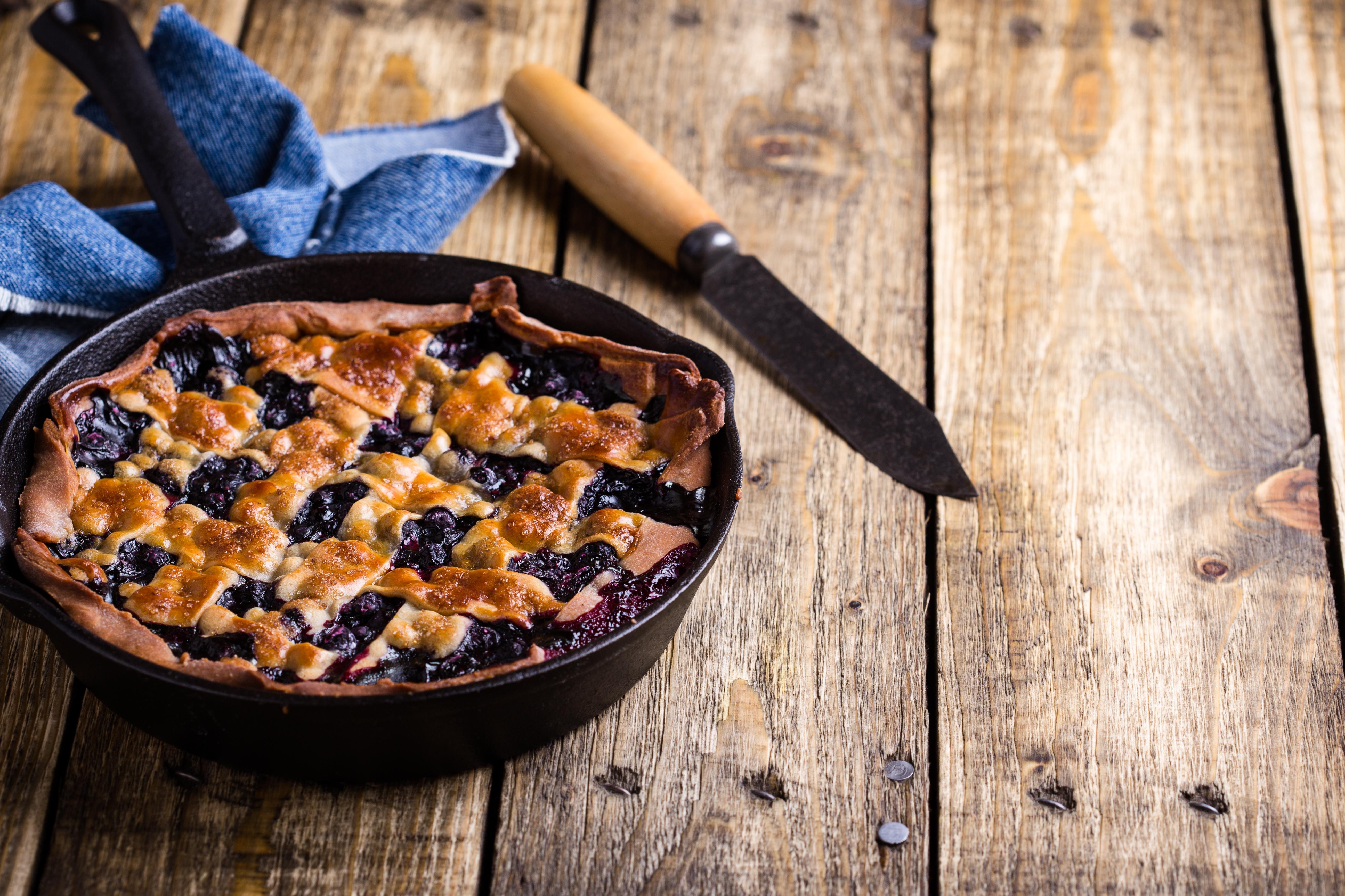 Rustic homemade blueberry pie in pan