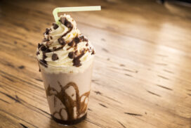 Chocolate Frappe Chocolate Milk Shake - Frappe topped with whipped cream and chocolate sauce with chocolate pieces.