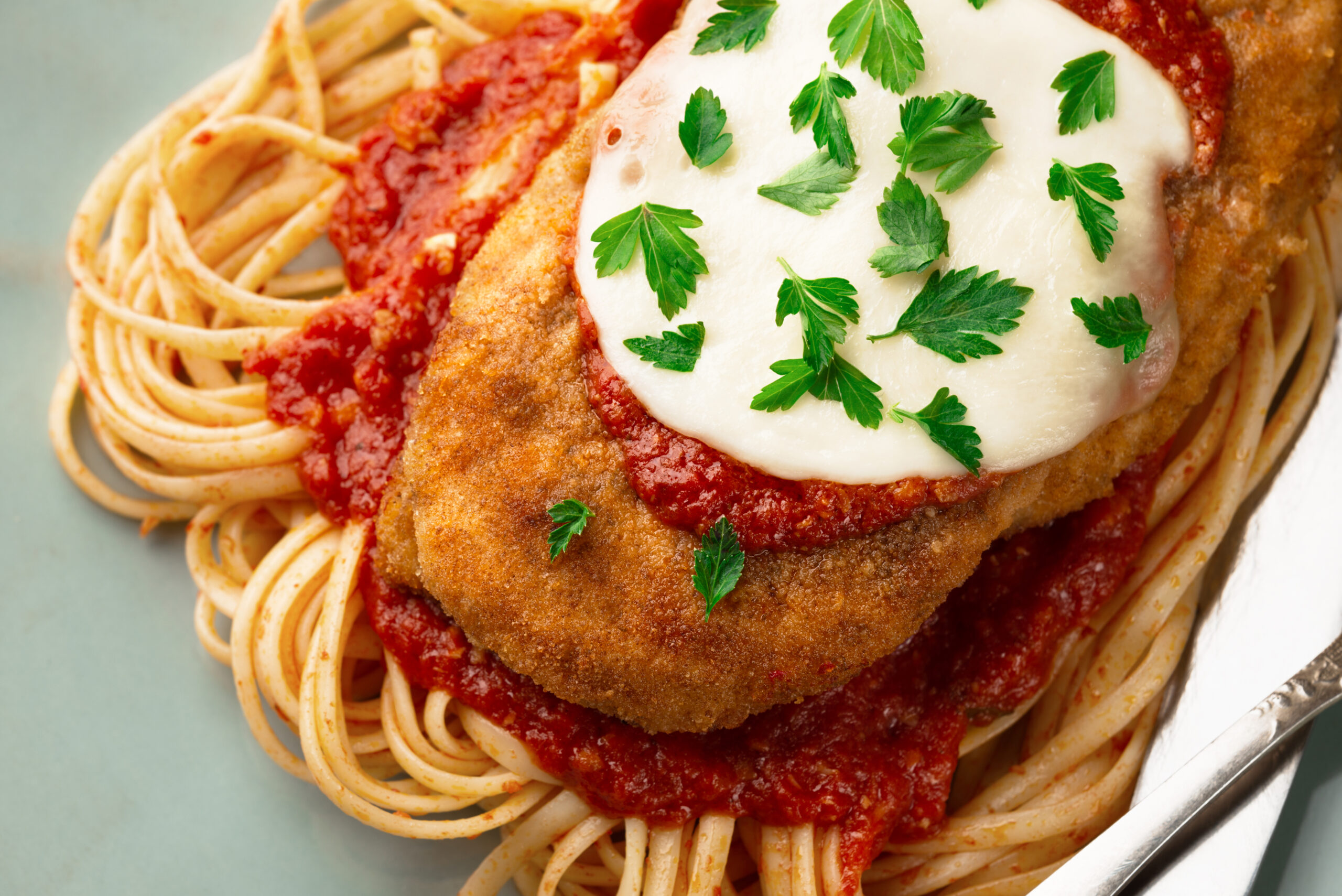 Plate CHICKEN PARMIGIANA with linguini pasta Like an Italian
