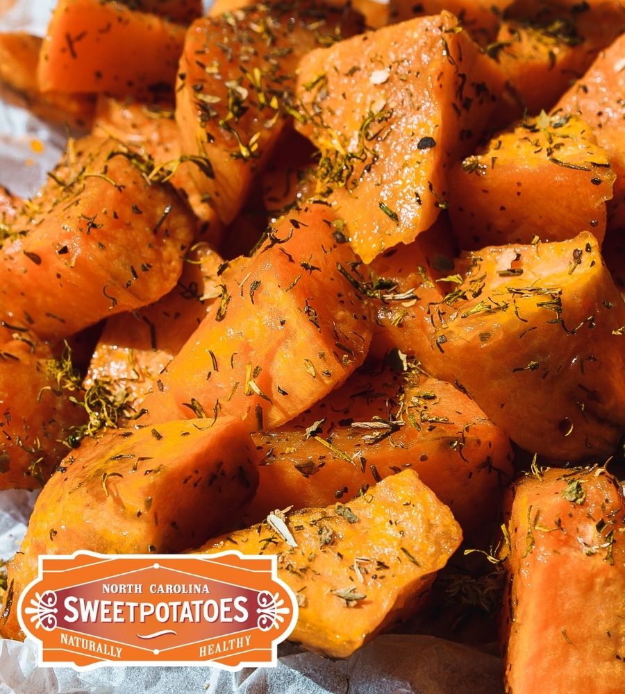 A pile of sweet potato pieces, grown in North Carolina. Baked and coated in oil, parsely, salt and pepper